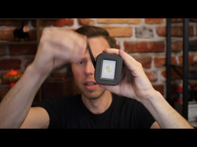 Person demonstrating how to crank a wind-up emergency NOAA weather radio.